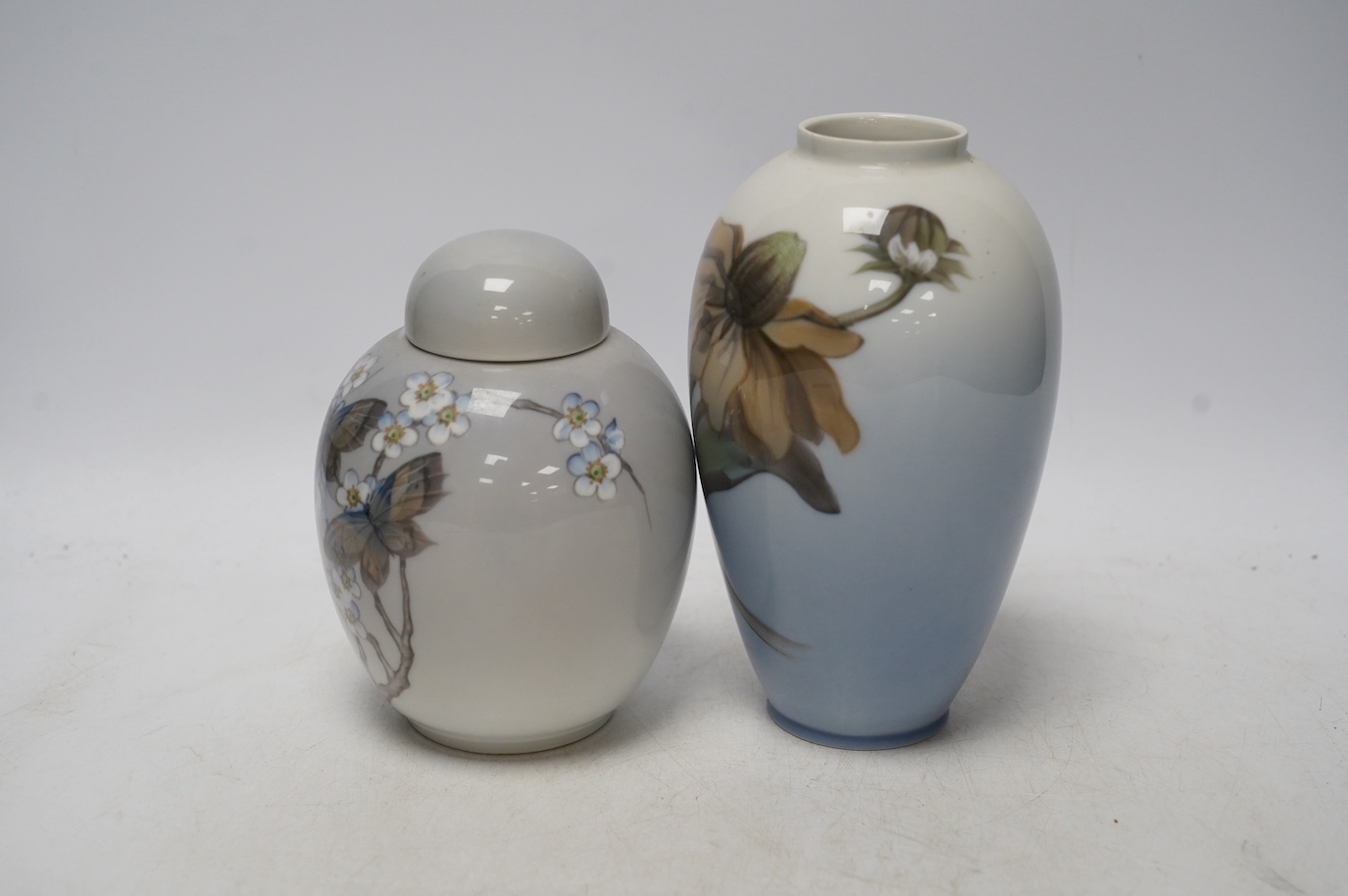 A Royal Copenhagen jar and cover and a similar vase, largest 18cm high. Condition - good